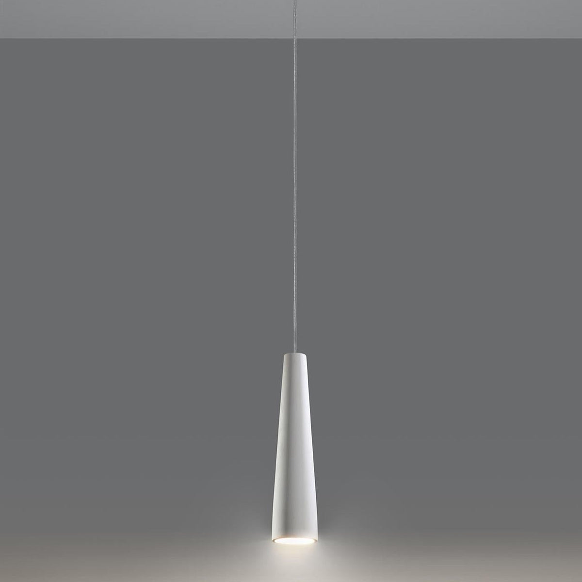 White ceramic cone pendant light hanging with warm LED glow, modern minimalist design, sleek tapered shade finish