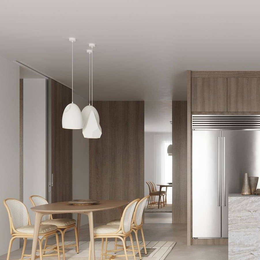 White ceramic pendant lamps with matte finish hanging in modern kitchen - contemporary lighting fixture trio