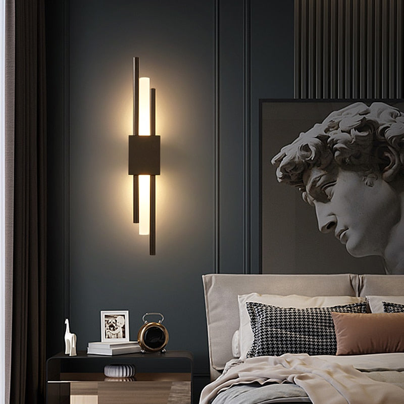 Black Emporium LED wall lamp with vertical light bars in modern bedroom, warm white lighting, contemporary design