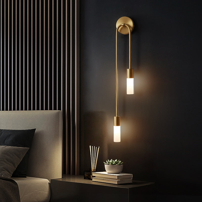 Spire Sleek LED Wall Light brass finish with dual hanging tubes in modern bedroom setting - sconce lighting UK
