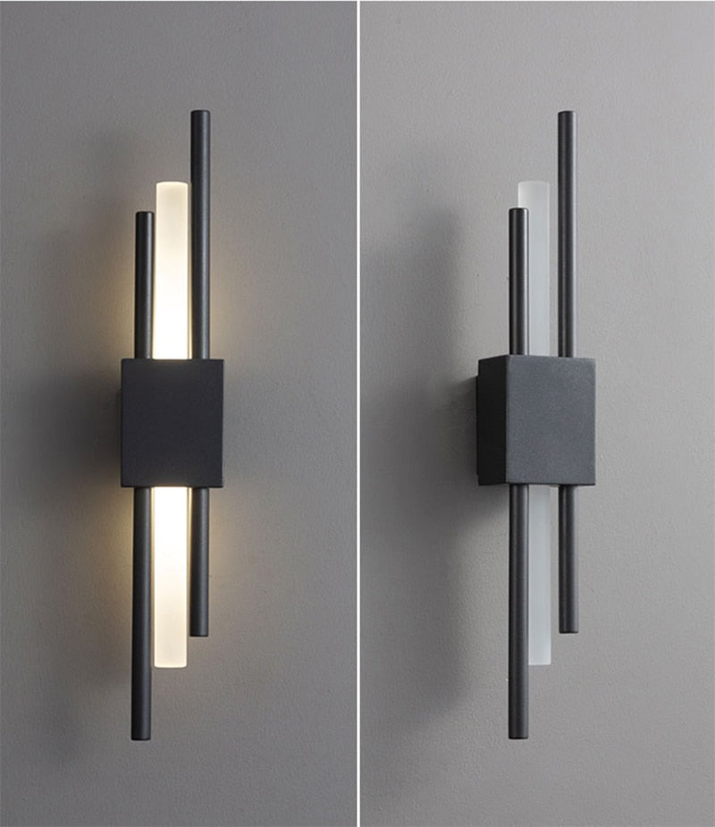 Modern black metal Emporium LED wall lamp shown on/off - linear design with warm white light strip and cube mount