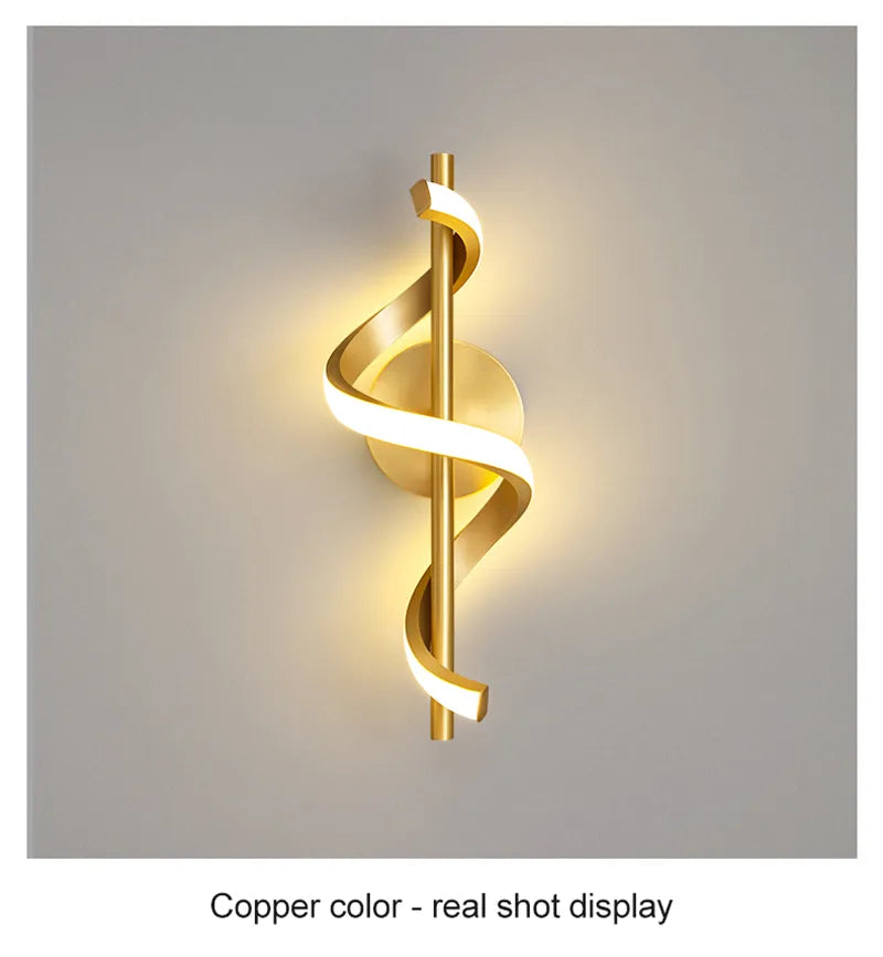 Copper twisted LED wall light with warm glow - real display showing golden finish and spiral ribbon design