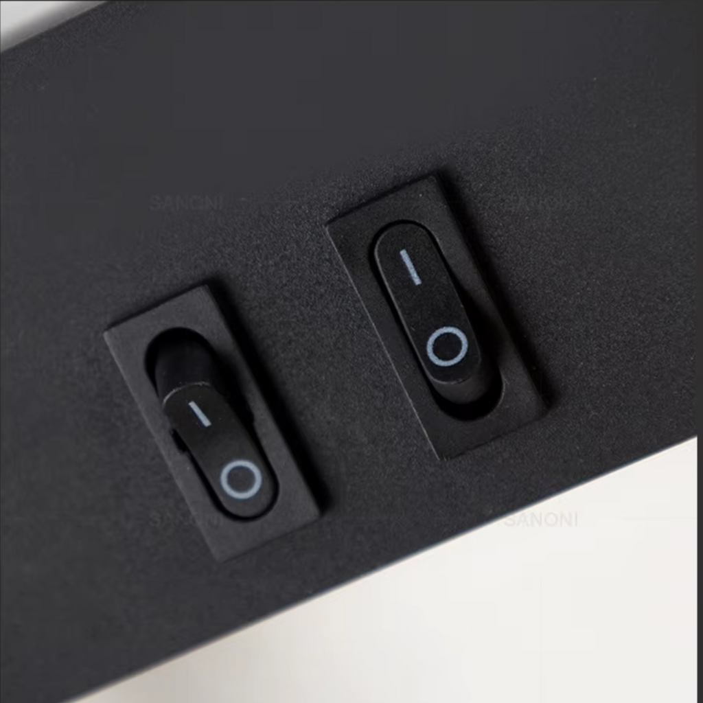 Close-up of black LED wall lamp switches showing on/off controls with white indicator lights and matte finish